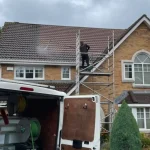 cleaning moss from a roof