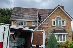 cleaning moss from a roof